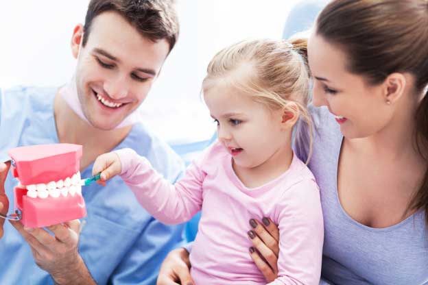 A small girl at the dental clinic