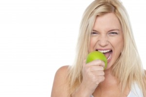 A girl eating an apple