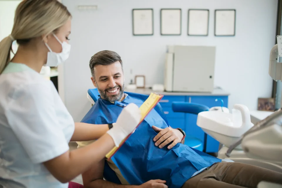 A dentist consulting with a patient during a general dentistry appointment in Arlington Heights, IL